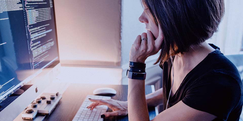 computer programmer in front of computer